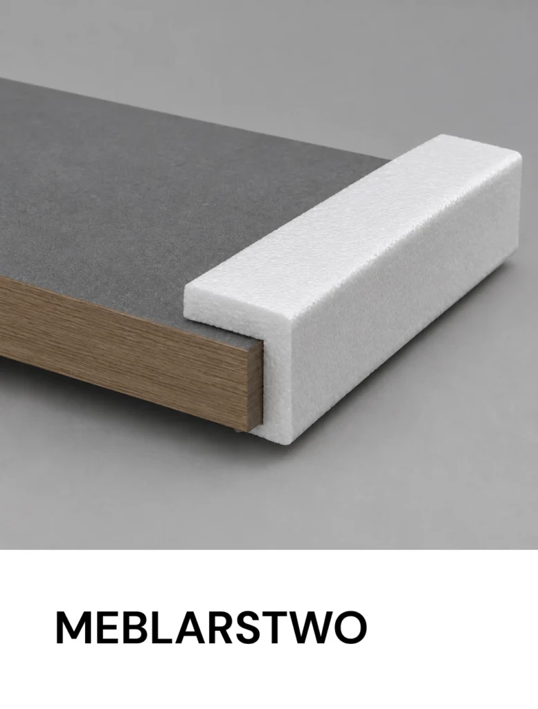 Close-up of a gray panel edge with a wooden core and a white foam block, with the word 'MEBLARSTWO' visible below.
