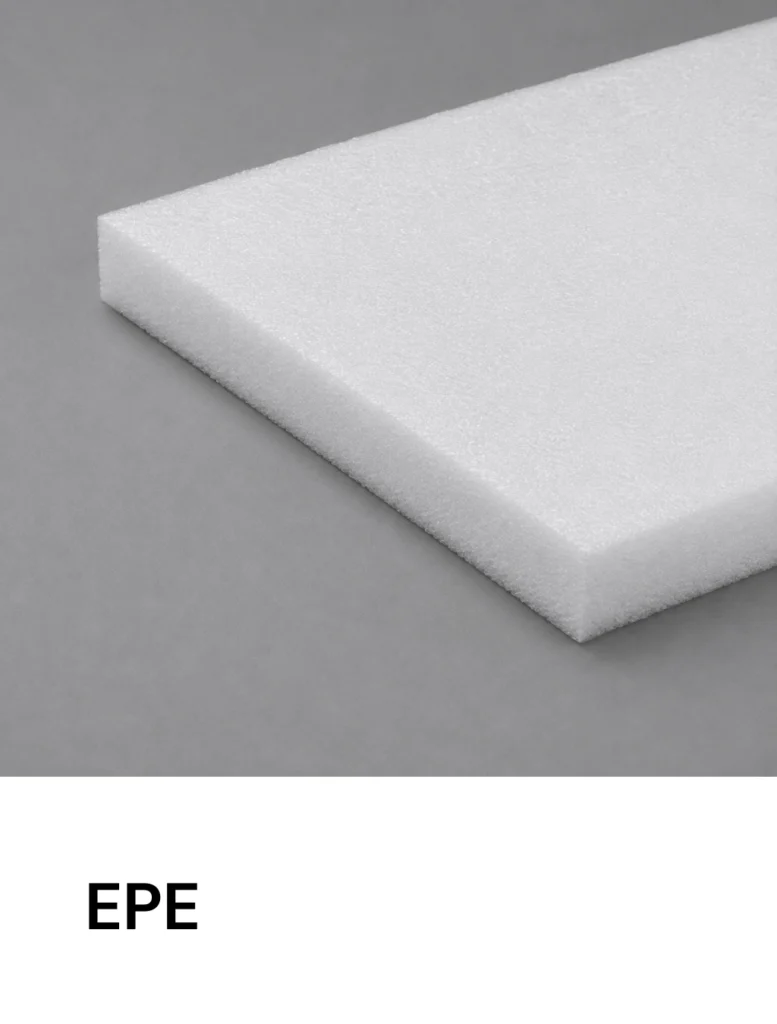 Corner of a white EPE foam block on a gray background.