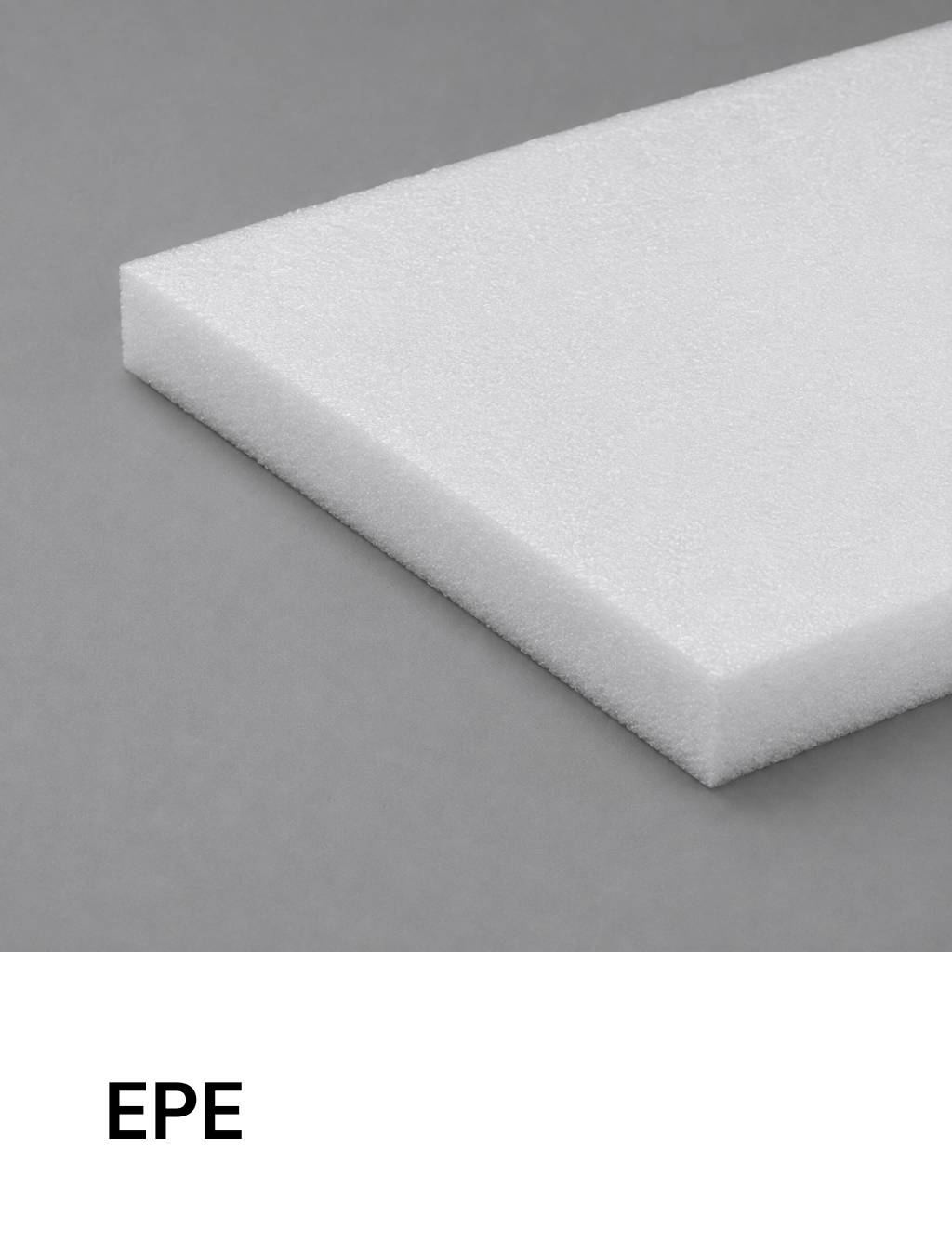 Corner of a white EPE foam block on a gray background.