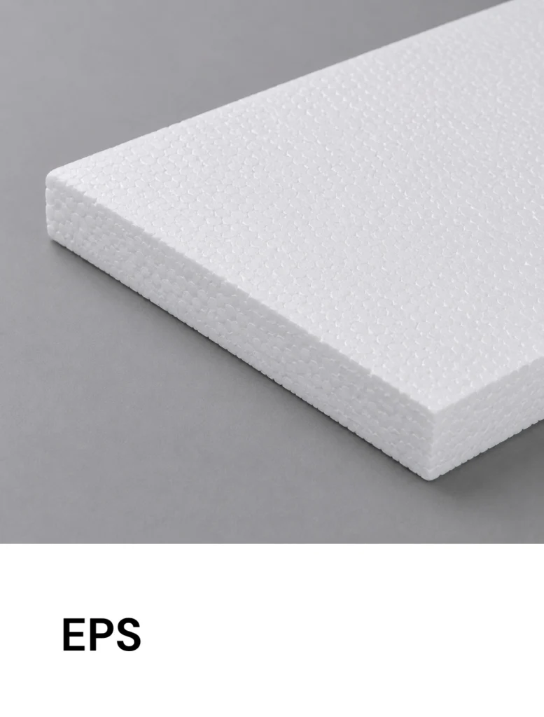 White expanded polystyrene foam block on a gray background, close-up of its textured surface