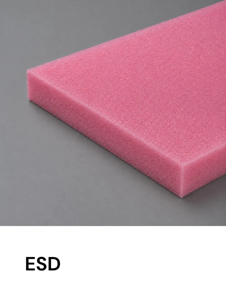 Pink ESD foam block on a gray surface, with 'ESD' text visible at bottom. Excellent for anti-static packaging needs.