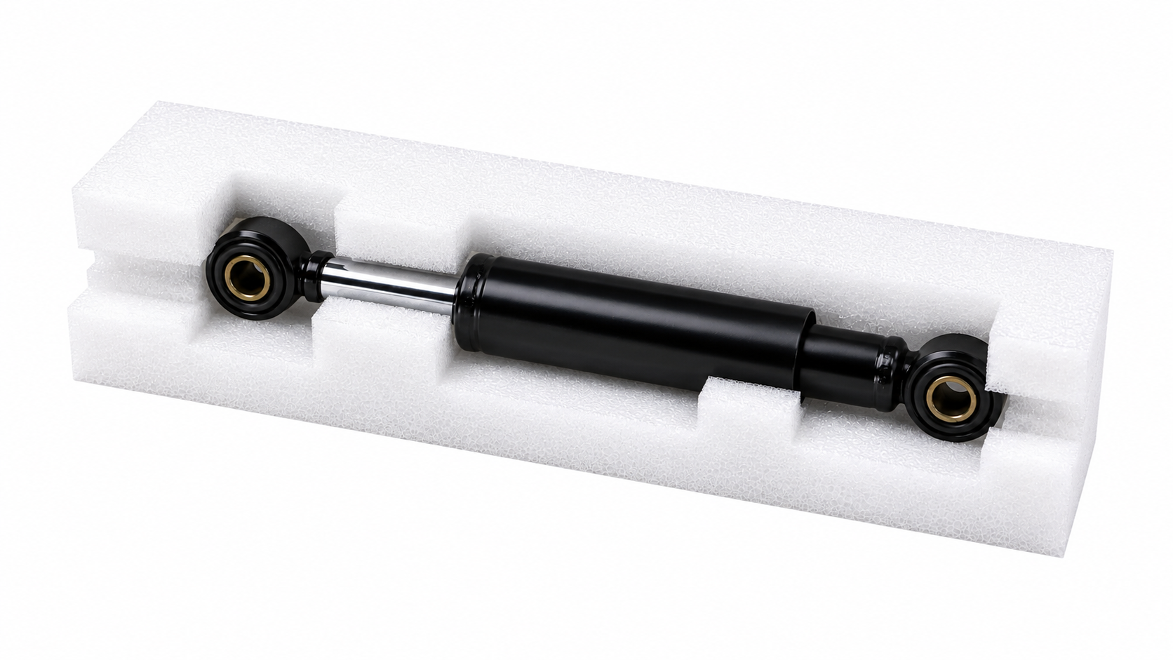 Black hydraulic shock absorber secured in white foam packaging