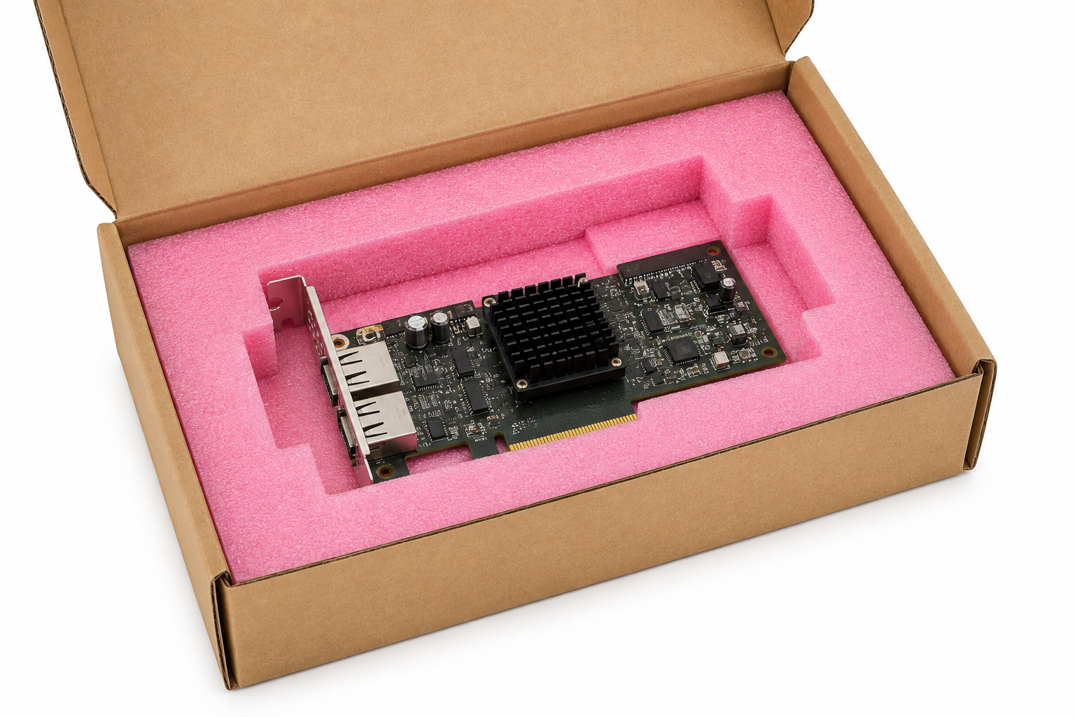 Graphics card placed in pink foam padding inside a brown cardboard box (packaged shipping/box contents).
