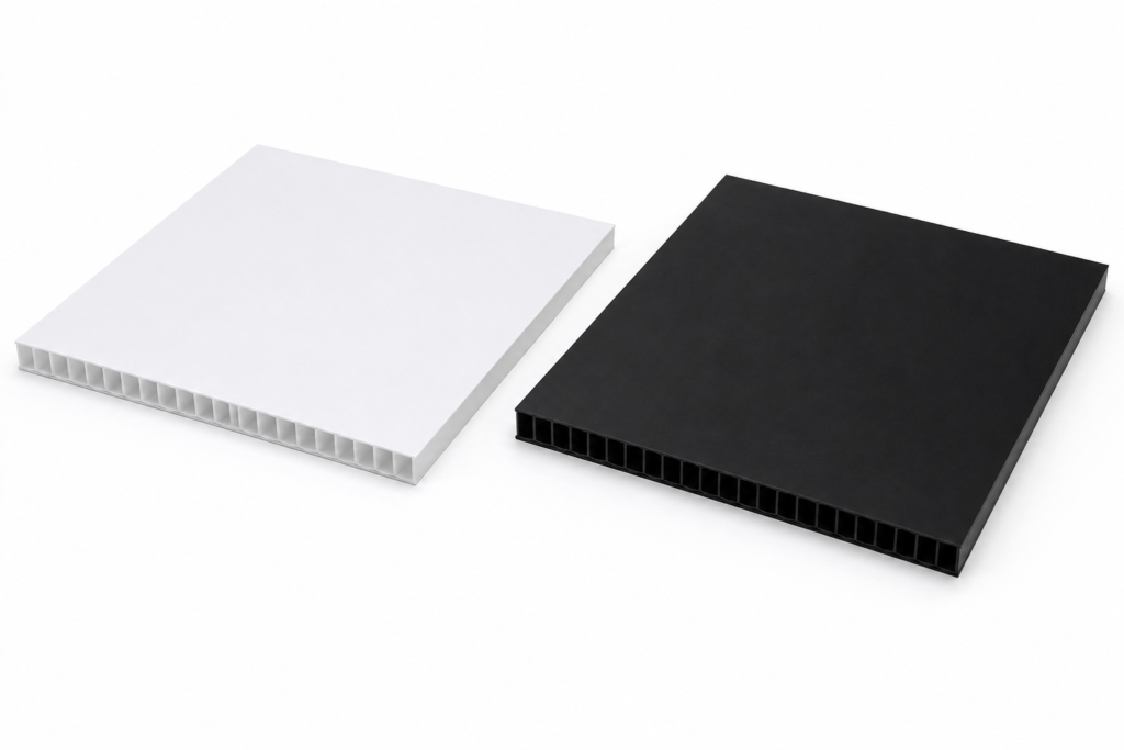 Two square hollow-core panels, white on the left and black on the right, showing the honeycomb interior edge at the bottom edge of each panel.