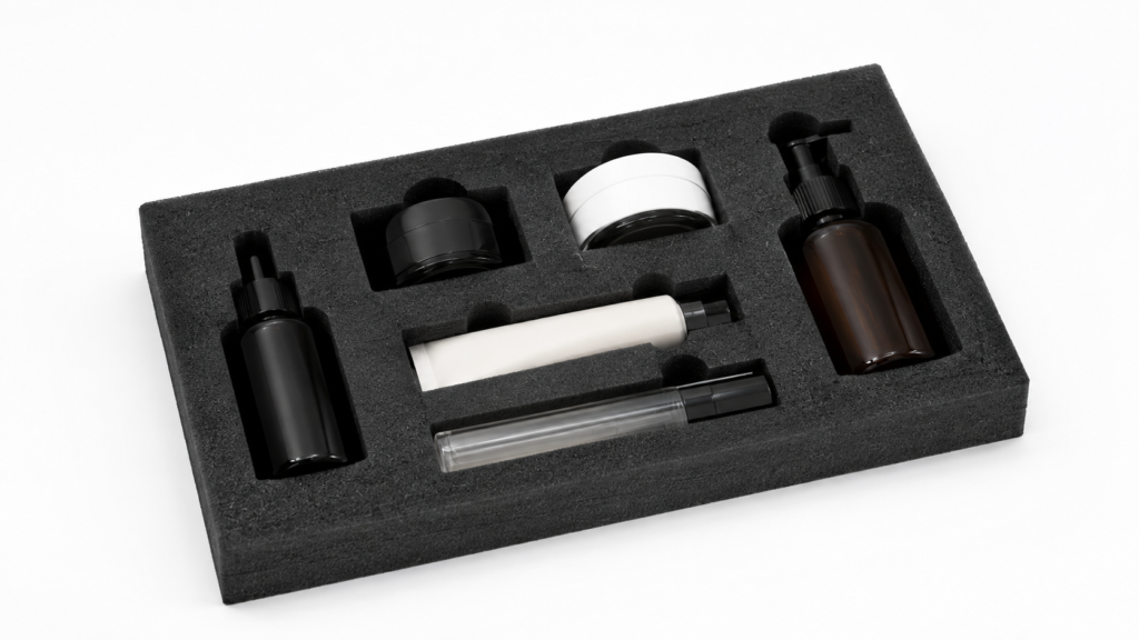 Foam insert holding a cosmetics kit: bottles, jars, and tubes arranged in cutouts on a black tray